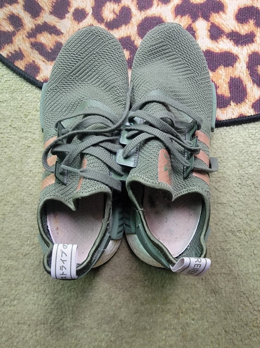Adidas NMD_R1 sneakers. Green colorway with metallic copper three stripe.